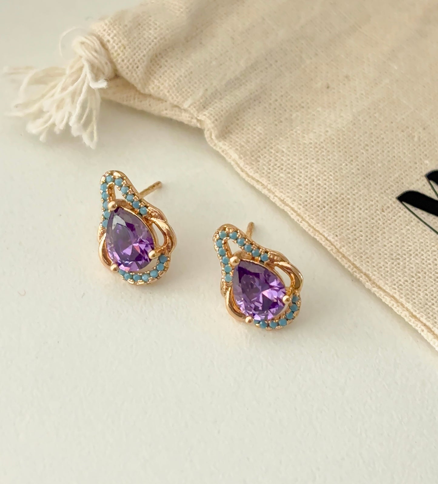 Purple teardrop studs