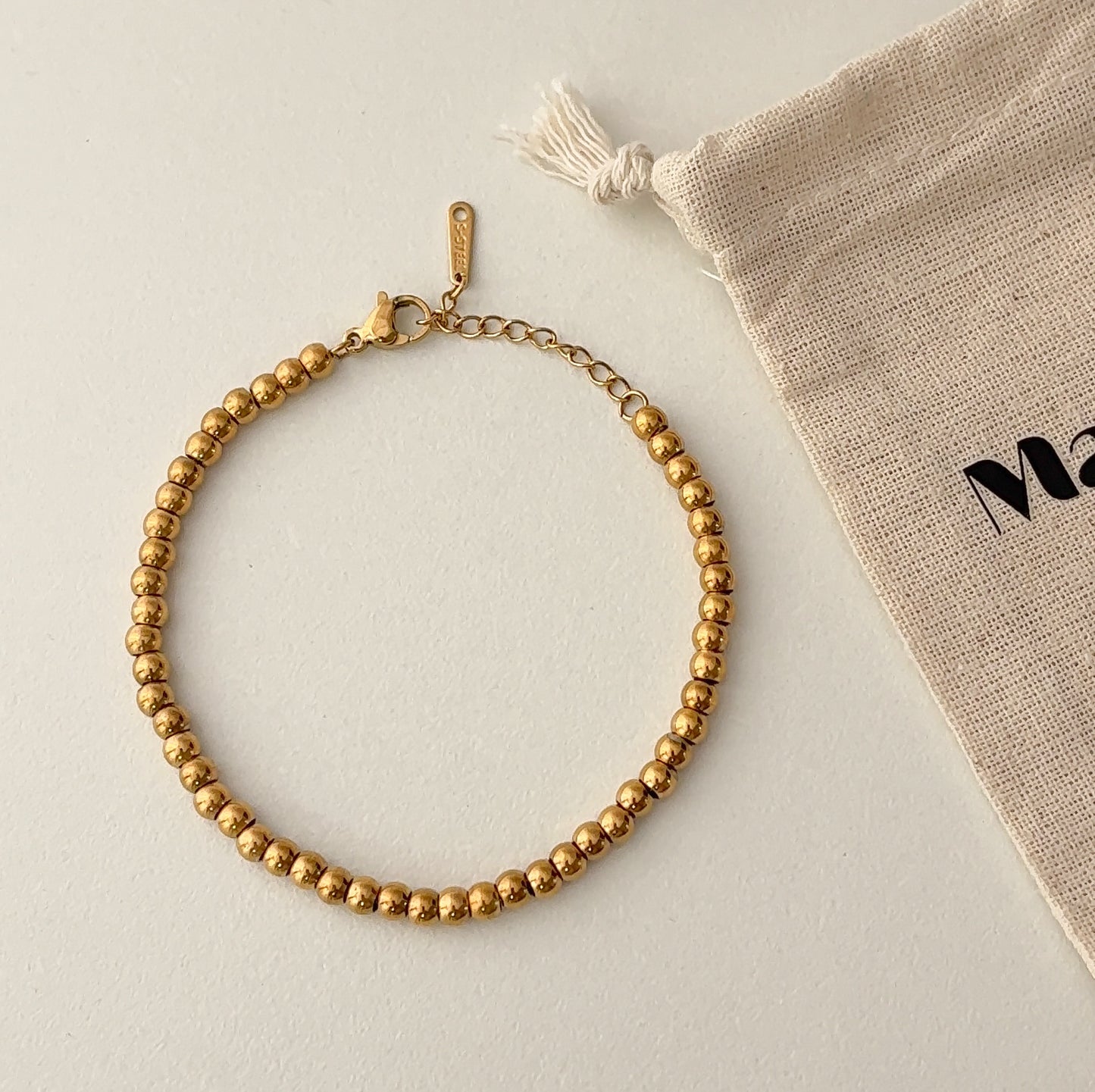 Golden globule wristlet bracelet