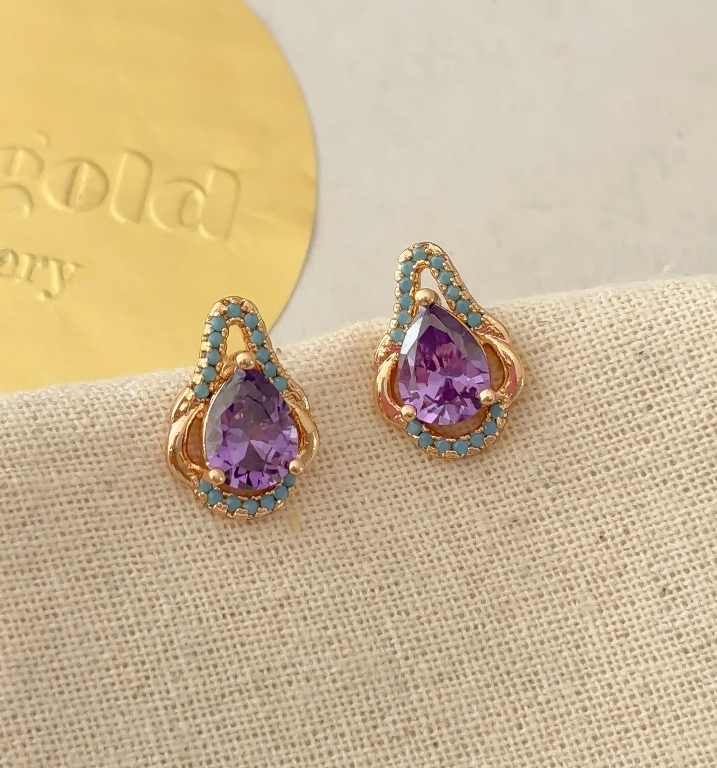 Purple teardrop studs